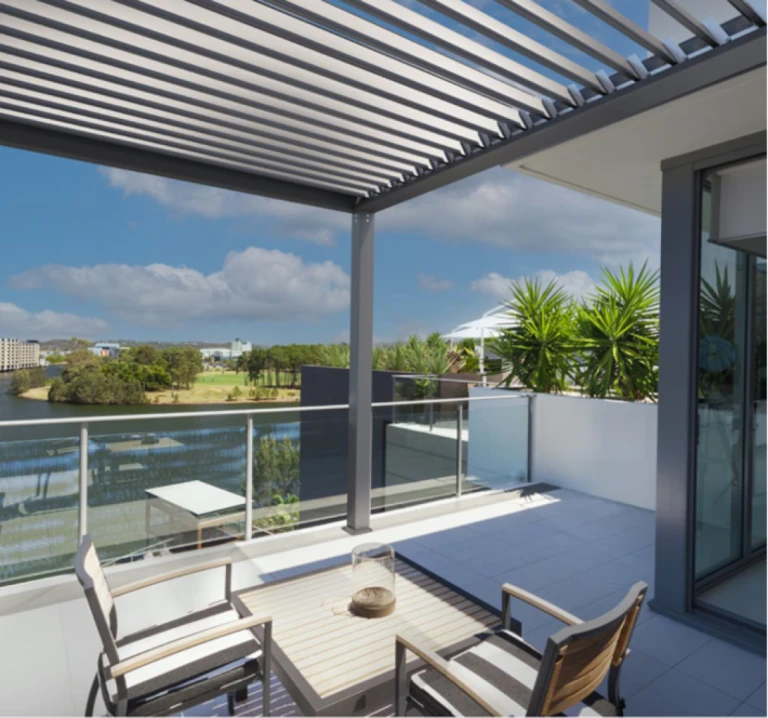 A modern terrace overlooking the lake with a bioclimatic pergola