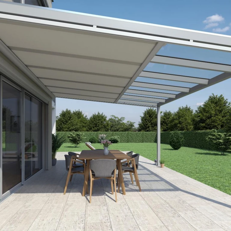 A modern terrace with a glass roof, a retractable fabric awning, and dining seating in the garden.
