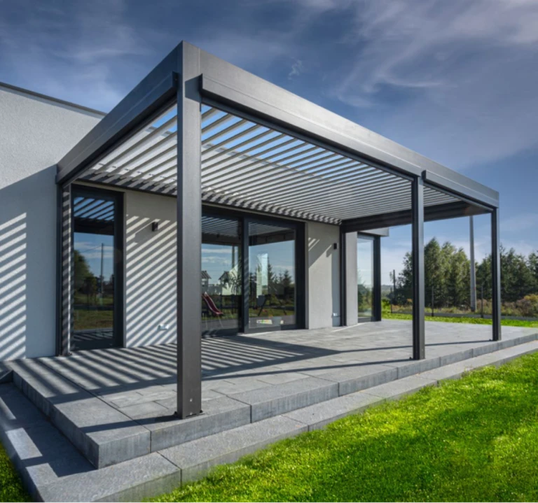 A modern bioclimatic pergola with adjustable slats on the terrace of a single-family home