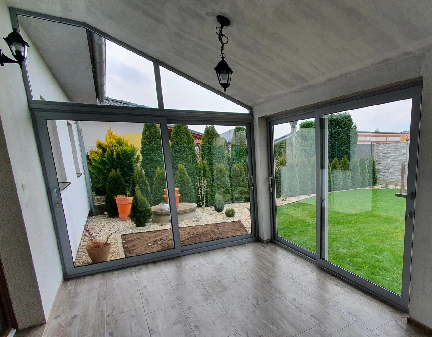 Modern terrace glazing with sliding doors and a view of the garden