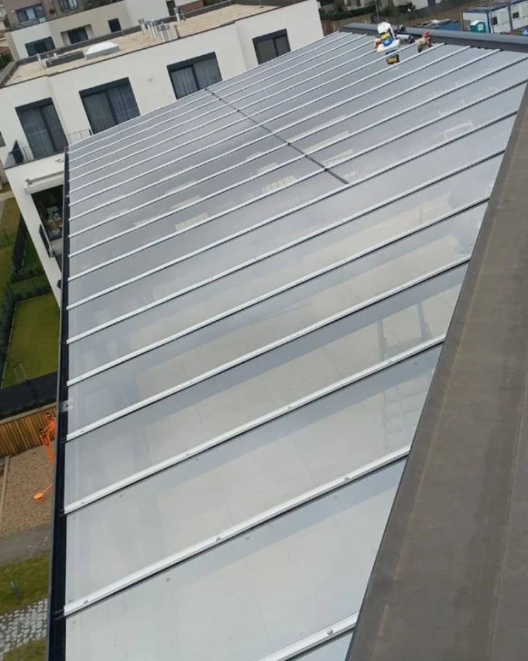 A bird's-eye view of the glass roof of the aluminum pergola on the terrace