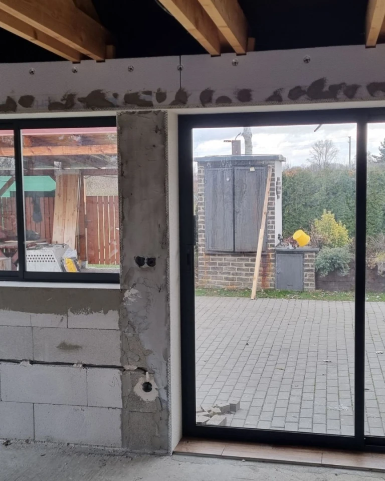 A terrace under construction with Robust aluminum glazing installed and a view of the outdoors